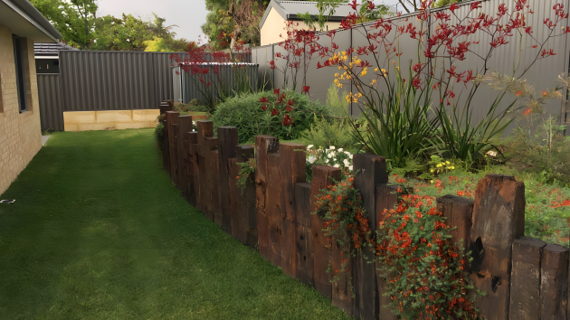 Finished Perth backyard by Landscapes For Life with paving, garden beds and a lawn